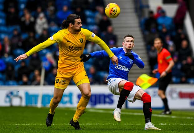 Ciaron Brown battling against Ryan Kent in a game at Ibrox. Picture: SNS