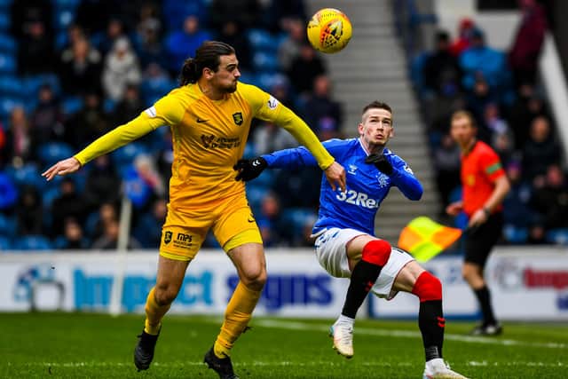 Ciaron Brown battling against Ryan Kent in a game at Ibrox. Picture: SNS