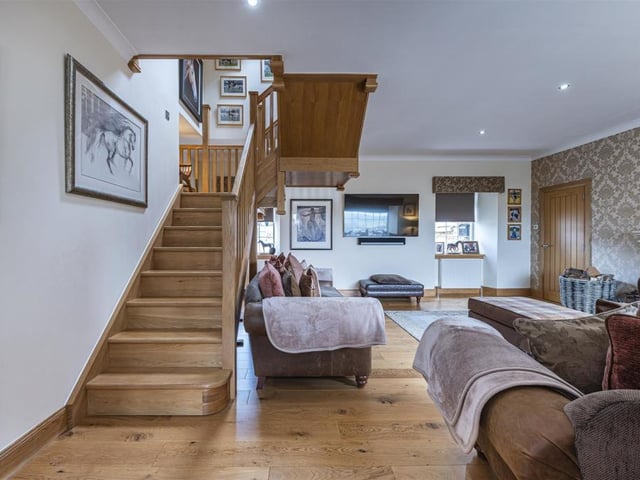 Lounge with oak staircase.