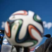 Australia's coach Ange Postecoglou speaks at a press conference after the team's final training run in Cuiaba, Brazil, on June 12, 2014.  Ahead of Australia taking on Chile in their first match.   (WILLIAM WEST/AFP via Getty Images)