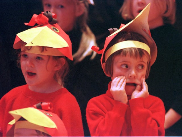 We all remember getting bored during our school’s nativity play - here we can see one kid finding a way to keep themselves entertained. Picture: 11 December 1998