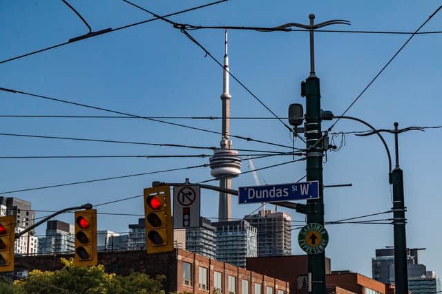 It is a typical Scene in Toronto. From many places one can see the CN-Tower in the background, marking the busy city center