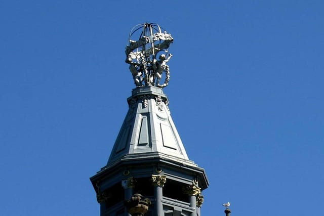 This fine-looking finial occupies the top of which city centre building?