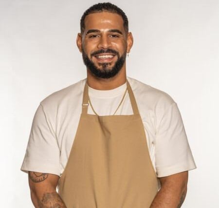 Sandro was born in Angola, but fled the Angolan war with his mum when he was two, settling then in London. Passionate about fitness, Sandro is a keen boxer and has a background in ballet and breakdance too! When Sandro was 21 his father passed away and he turned to baking as a form of therapy. Now, he lives and breathes it, and is often found rustling up bakes in a relaxed vibe with the telly on, or running virtual baking classes for children with autism. He likes to infuse his bakes with flavours from his Angolan heritage – the spice of paprika paired with tangy cheese, and sweet bakes smothered in sticky dulce de leche.