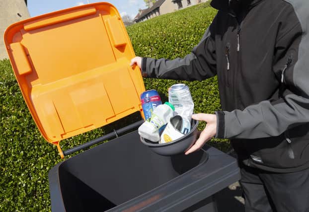 The new orange-lidded bin is for tins, cans, foil, aerosols, food and drinks cartons as well as plastic bottles, pots, tubs, and trays.