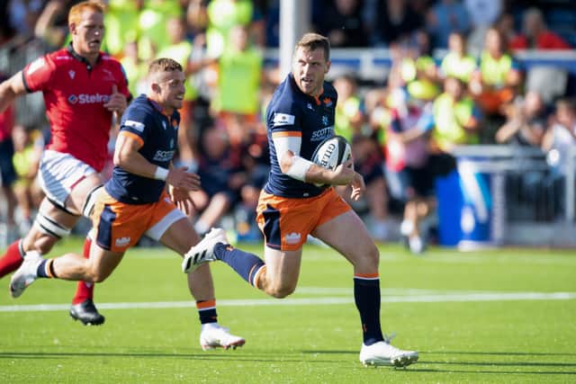 Mark Bennett goes through to score Edinburgh's first try at their new stadium. Picture: Ross Parker/SNS