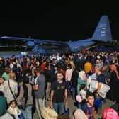 People evacuated from Sudan arrive at a military airport in Amman on April 24, 2023. - Foreign countries rushed to evacuate their nationals from Sudan as deadly fighting raged into a second week between forces loyal to two rival generals. (Photo by Khalil MAZRAAWI / AFP) (Photo by KHALIL MAZRAAWI/AFP via Getty Images)