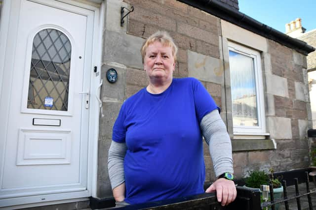 Joyce Langlands outside of the home she shares with her mother, June.