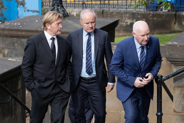 Former Rangers players Stuart McCall (L) and John Brown (R) arrive at the funeral of Rangers kitman Jimmy Bell