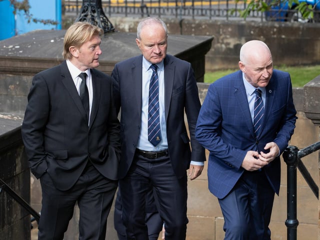 Former Rangers players Stuart McCall (L) and John Brown (R) arrive at the funeral of Rangers kitman Jimmy Bell