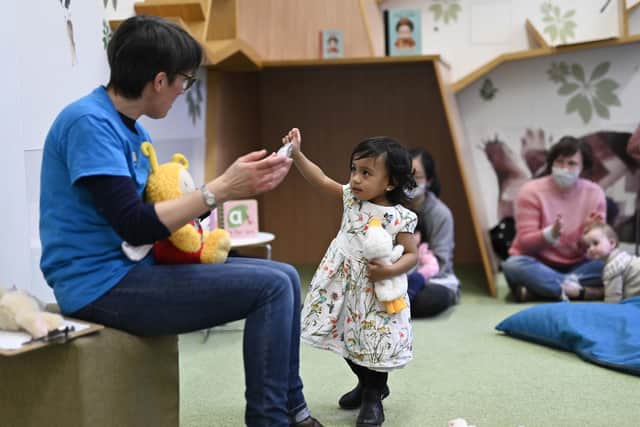 Zoe Johnstone giving a Bookbug session at the Central Children's Library in Edinburgh. This session involves singing, reading and dancing. (Picture credit: John Devlin)