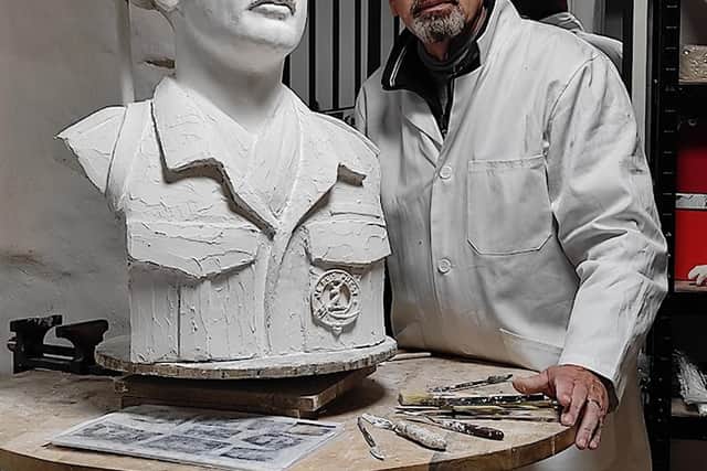 Sculptor Dan Robert works on the bronze bust of Lord Lovat, which will be unveiled on the 80th anniversary of D-Day.