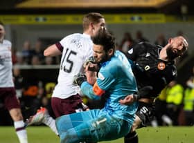 Hearts goalkeeper Craig Gordon was badly injured in this collision with Dundee United striker Steven Fletcher.