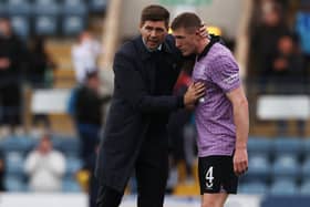 Rangers boss Steven Gerrard gives words of encouragement to John Lundstram at full-time after his side's win over Dundee. Picture: SNS