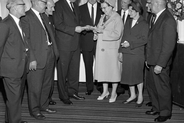Employees of the North British Rubber Company receive long service awards in 1965.