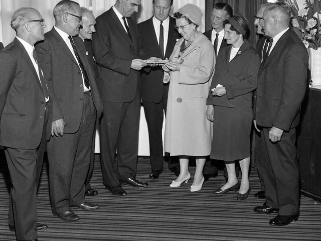 Employees of the North British Rubber Company receive long service awards in 1965.