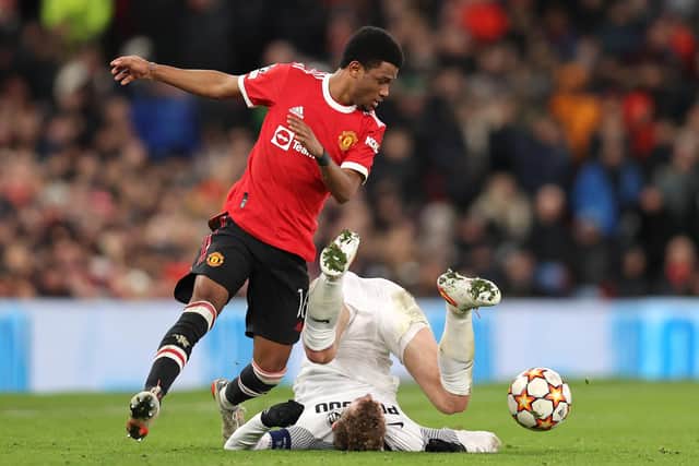 Amad Diallo (left), pictured in action for Manchester United in their Champions League match against Young Boys last month, is set to make his Rangers debut against Ross County on Saturday. (Photo by Clive Brunskill/Getty Images)