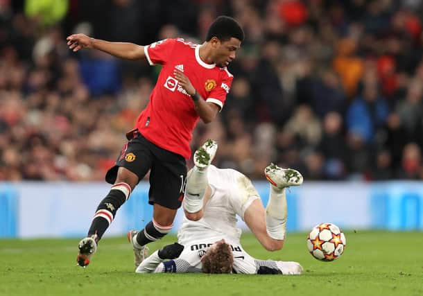 Amad Diallo (left), pictured in action for Manchester United in their Champions League match against Young Boys last month, is set to make his Rangers debut against Ross County on Saturday. (Photo by Clive Brunskill/Getty Images)