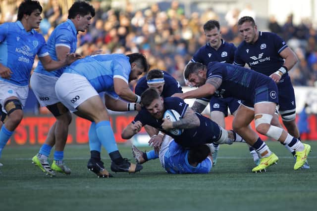 Scotland's Kyle Steyn struggles to keep the ball during the win over Uruguay at Estadio Charrua in Montevideo. (Photo by Ernesto Ryan/Getty Images)