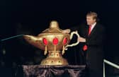 In 1990, the then real estate developer Donald Trump rubs a "magic lamp" during the opening ceremony for his Taj Mahal casino in Atlantic city (Picture: Bill Swersey/AFP via Getty Images)