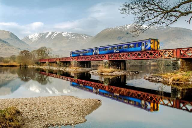 The Scotrail 156 super sprinter crosses the head of Loch Awe on the Glasgow-Oban line, near Dalmally, Argyll.