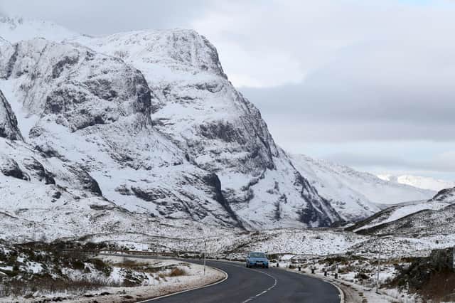 A car travels along the A82 in Glencoe in the Highlands. Picture: Andrew Milligan/PA Wire