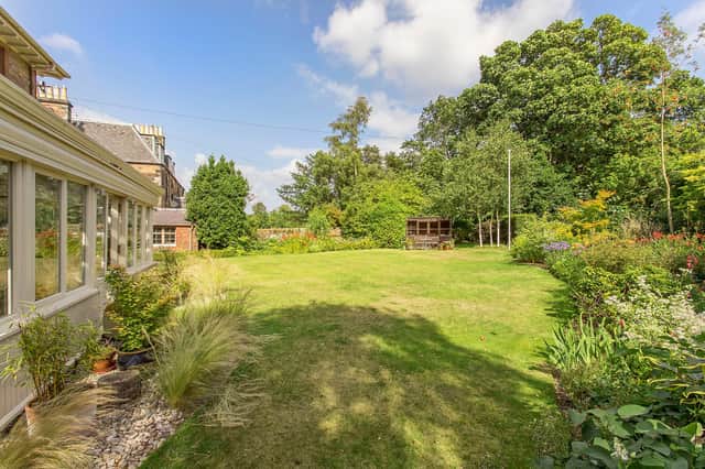With a half acre of mature gardens, this is the dream balance of Victorian home, outside space and city living.
