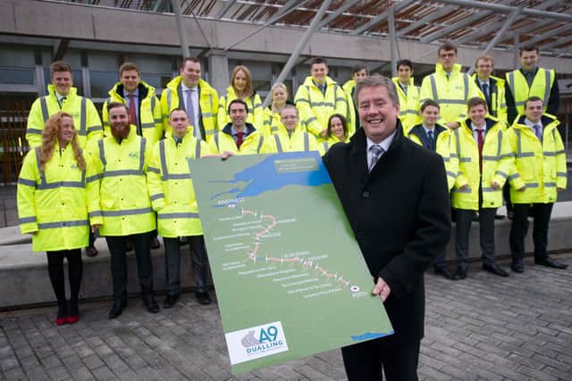 The then Infrastructure Secretary Keith Brown with the A9 dualling plans in 2014. Picture: Jane Barlow