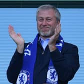 Chelsea's Russian owner Roman Abramovich applauds one of the team's five EPL title wins during his tenure.  (Photo credit should read BEN STANSALL/AFP via Getty Images)