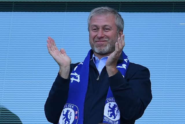 Chelsea's Russian owner Roman Abramovich applauds one of the team's five EPL title wins during his tenure.  (Photo credit should read BEN STANSALL/AFP via Getty Images)
