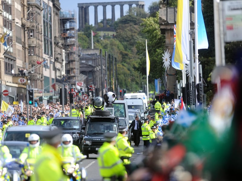 Pope Benedict XVI makes his way along Princes Street in Edinburgh.