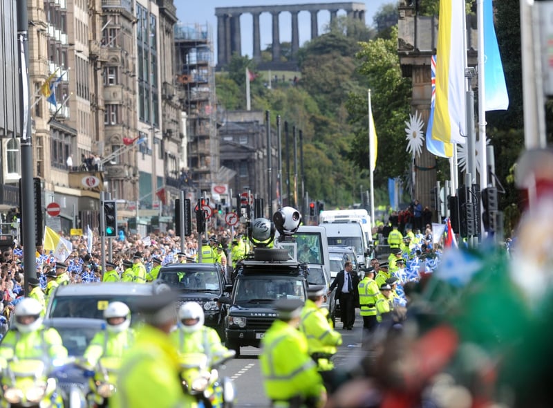 Pope Benedict XVI makes his way along Princes Street in Edinburgh.