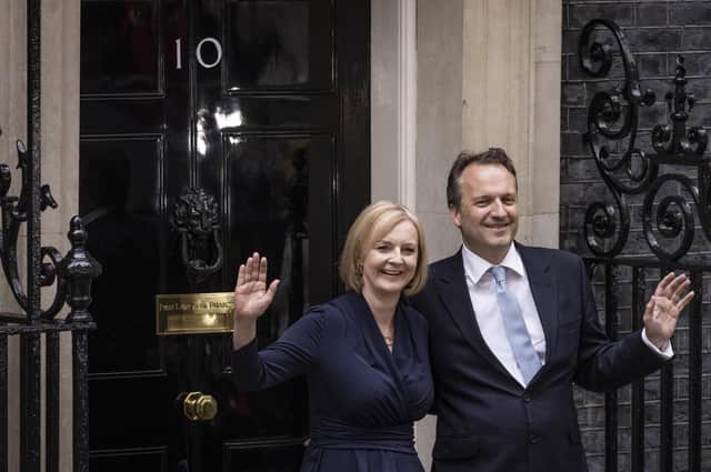 Liz Truss and husband Hugh O'Leary pose outside number 10 Downing Street