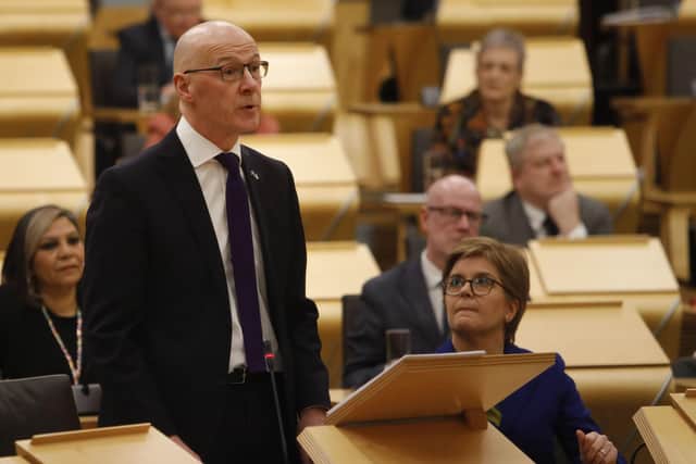 Deputy First Minister John Swinney MSP watched by First Minister Nicola Sturgeon as he delivered his budget to the Scottish Parliament.