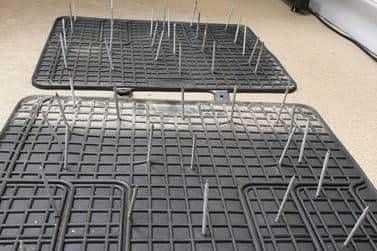 Police Scotland say the car mats were laced with nails and deliberately placed on the A99 road near Wick on Saturday evening.