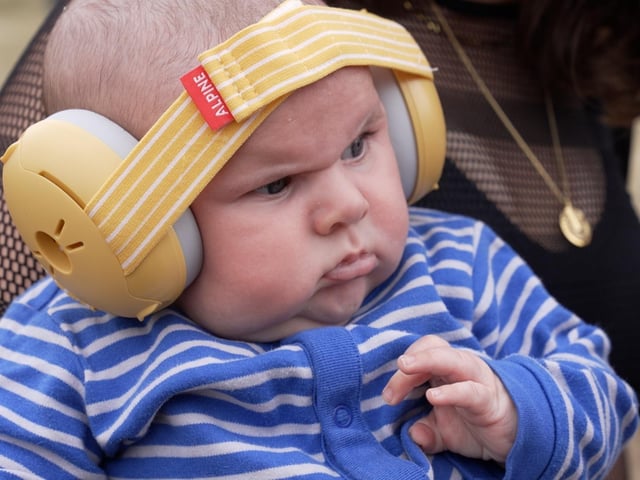 Baby Finlay, a 10-week-old, wearing striped one-piece pyjamas and ear protectors, who 'stole the show' as Annie Mac opened the Other Stage