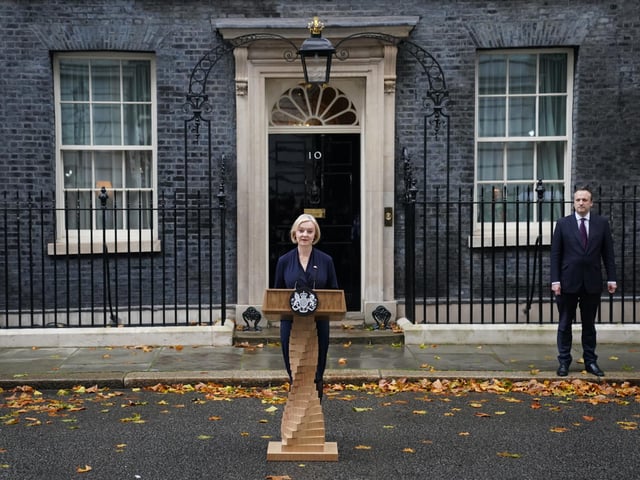 Liz Truss, with her husband Hugh O'Leary, makes a statement outside 10 Downing Street, London, where she announced her resignation as Prime Minister.