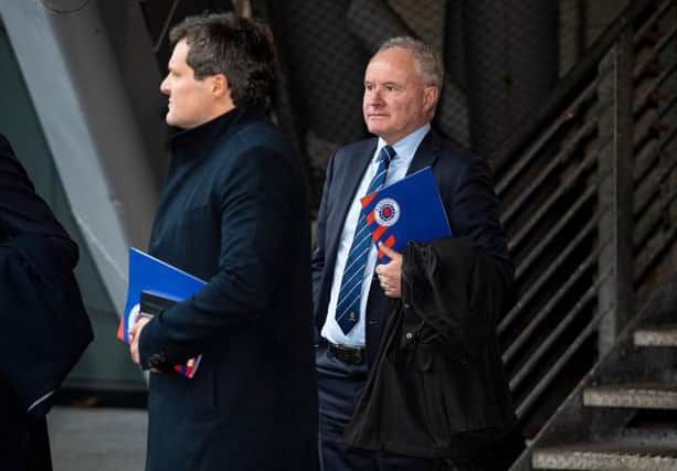 Rangers vice-chairman John Bennett (right) is pictured leaving the Ibrox club's AGM on Tuesday. (Photo by Ross MacDonald / SNS Group)