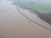 The flooded River Don between Kintore and Dyce on Saturday, downstream from the search at Monymusk.. Picture: Network Rail Scotland
