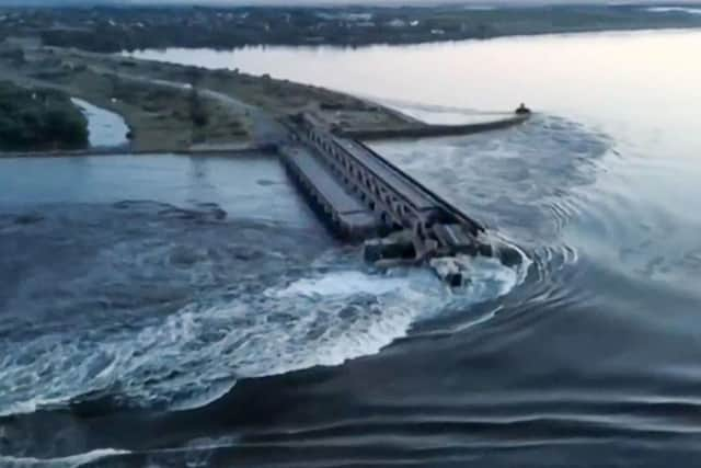 This screen grab from a video posted on Ukraine's president Volodymyr Zelensky's Twitter account shows an aerial view of the dam of the Kakhovka Hydroelectric Power Station after it was partially destroyed. Picture: Twitter/@ZelenskyyUa Twitter acc/AFP via Getty Images