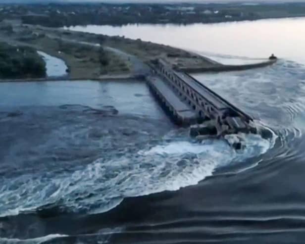 This screen grab from a video posted on Ukraine's president Volodymyr Zelensky's Twitter account shows an aerial view of the dam of the Kakhovka Hydroelectric Power Station after it was partially destroyed. Picture: Twitter/@ZelenskyyUa Twitter acc/AFP via Getty Images