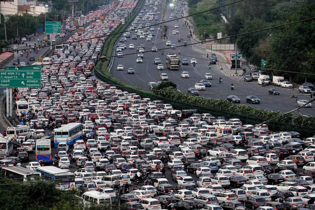 Vehicles are seen stuck in bumper to bumper traffic on the Delhi-Jaipur expressway in Gurgaon, on April 25, 2023. - India will overtake China as the world's most populous country in the coming week, hitting almost 1.43 billion people, the United Nations said on April 24. (Photo by Vinay GUPTA / AFP) (Photo by VINAY GUPTA/AFP via Getty Images)
