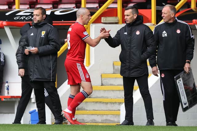 Aberdeen's Scott Brown (left) with manager Stephen Glass after being substituted during the 2-1 defeat to Celtic at Pittodrie on October 3. (Photo by Craig Williamson / SNS Group)