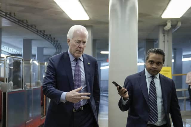 Sen. John Cornyn (R-TX) talks with reporters as he walks through the Senate subway on his way to a lunch meeting with Senate Republicans at the U.S. Capitol on June 14, 2022 in Washington, DC.   (Photo by Drew Angerer/Getty Images)