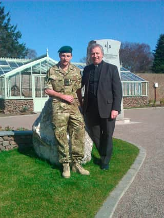 Very Rev Dr John Chalmers with his son, JJ Chalmers.