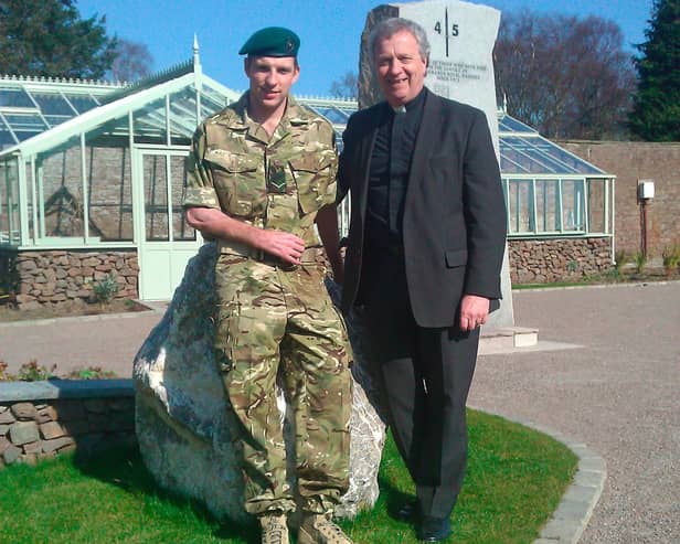 Very Rev Dr John Chalmers with his son, JJ Chalmers.