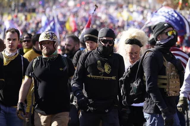People wearing shirts of the self-described “western chauvinists” group Proud Boys join Donald Trump supporters in a march in Washington on Saturday (Picture: Jacquelyn Martin/AP)