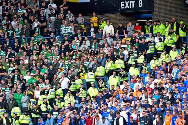 Police segregate between the supporters during the Ladbrokes Premier match between Rangers and Celtic at Ibrox Stadium, on September 1, 2019, in Glasgow, Scotland. (Photo by Rob Casey / SNS Group)
