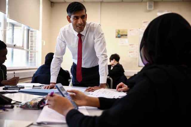 Rishi Sunak, seen visiting Harris Academy in London, wants schools to teach pupils maths until they are 18 (Picture: Henry Nicholls/WPA pool/Getty Images)