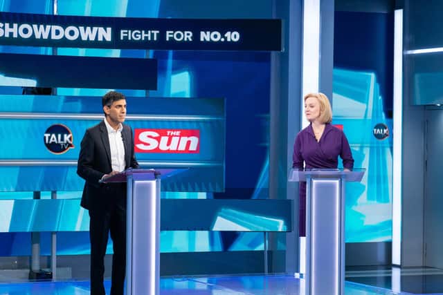 Liz Truss and Rushi Sunak during The Sun's Showdown: The Fight for No10, the latest head-to-head debate for the Conservative Party leader candidates, at TalkTV's Ealing Studios, west London.